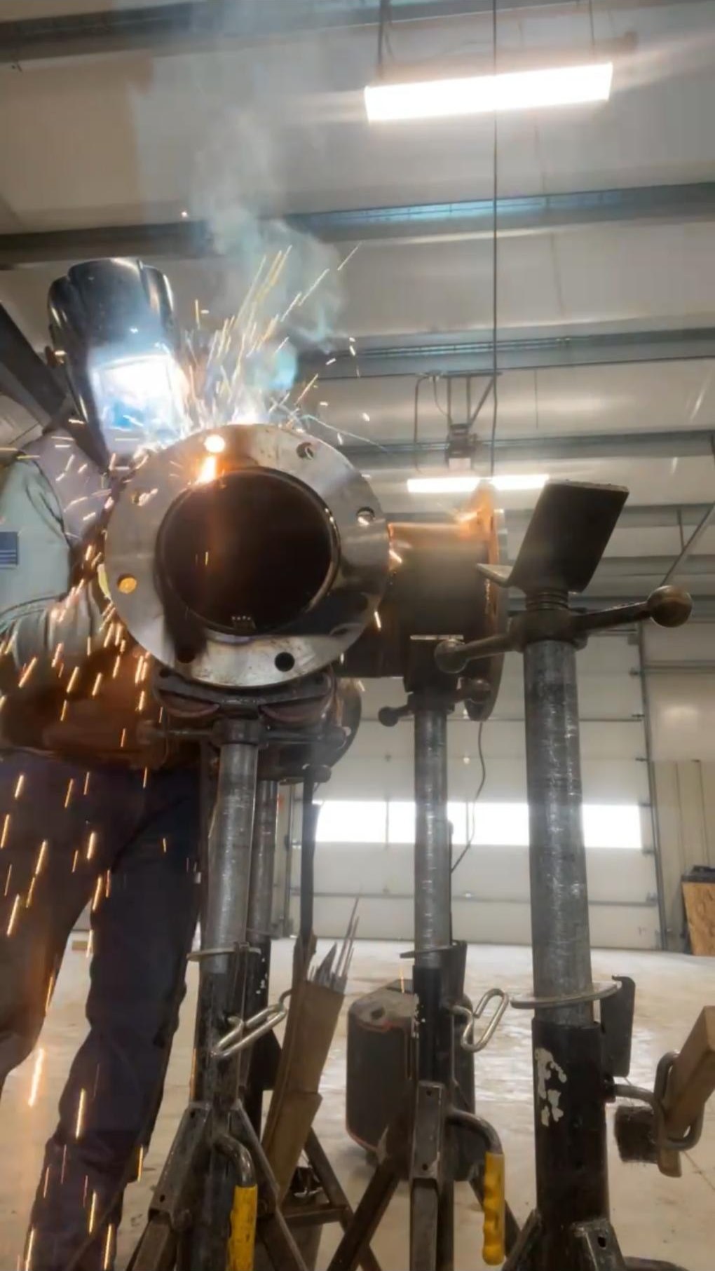 Welding a flange onto steel pipe in the shop
